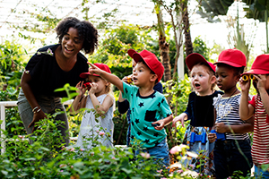 Students explore garden with educator